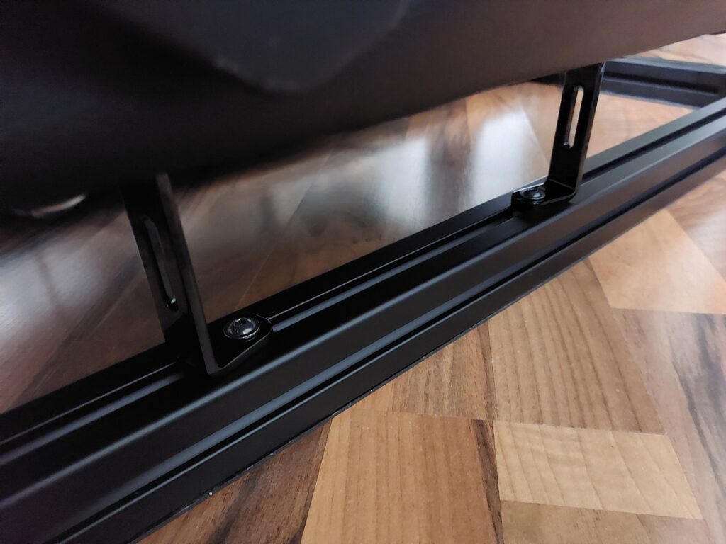 Seat with adapters attached to ground frame